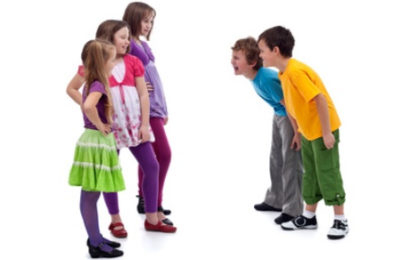Group of boys and girls confronting - gender interactions in childhood